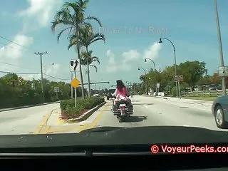 Chick on bike - short skirt no panties? shorts